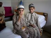 Pakistan&rsquo;s &lsquo;solar kids&rsquo;: Two brothers who collapse after sunset and can only move or talk during the day