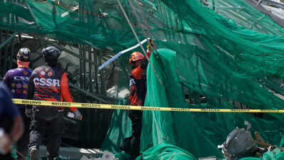 Rescuers search for 23 missing at collapsed Philippine building