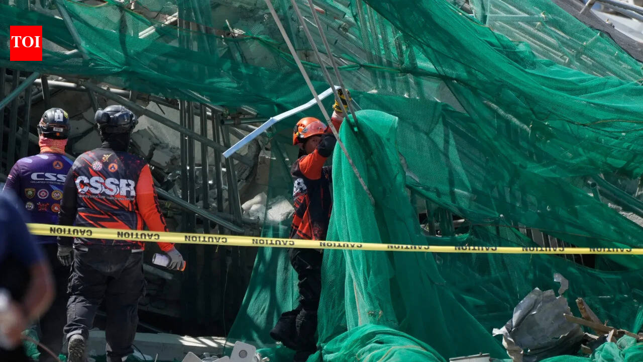 Rescuers search for 23 missing at collapsed Philippine building