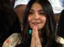 Anushka prays for Virat's win; spotted with Radha Naam counter - PICS