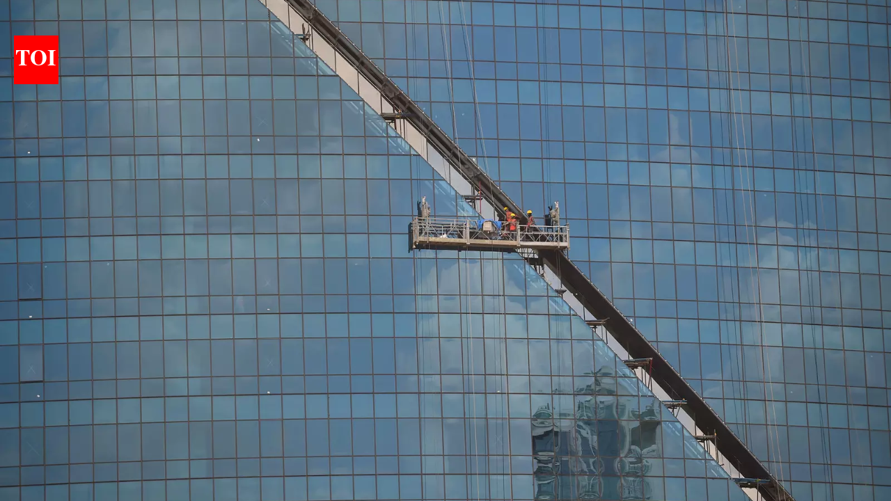 Why does India have glass buildings despite a hot climate?