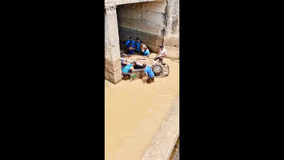 Two youths die as car falls off bridge