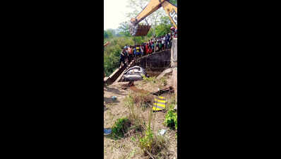 Two youths die as car falls off bridge