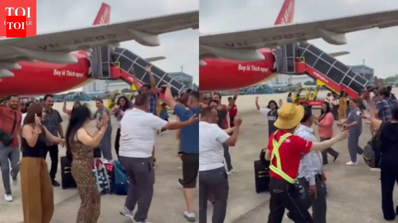 Indian travellers seen doing garba near airport tarmac; viral video raises questions about travel etiquette | - The Times of India