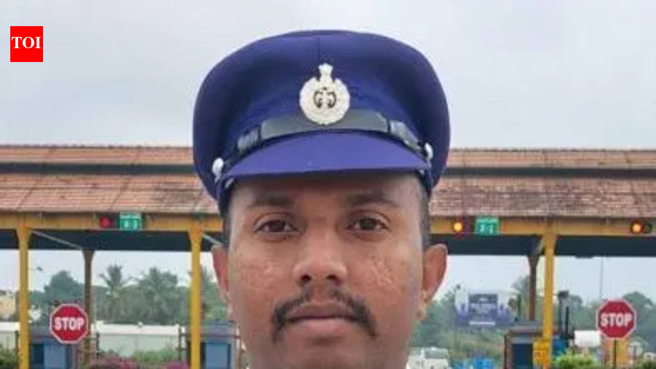 Cop carries specially challenged man on shoulder to cross flooded road in Bengaluru