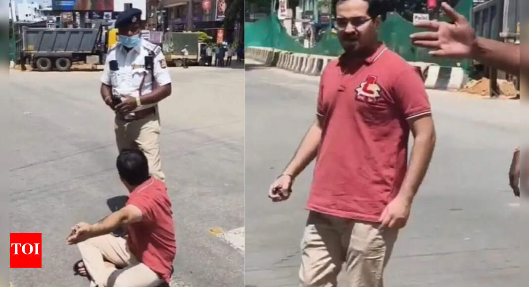 Man sits on road as pregnant wife 'trapped' in traffic jam after VIP convoy stops vehicles in Bengaluru