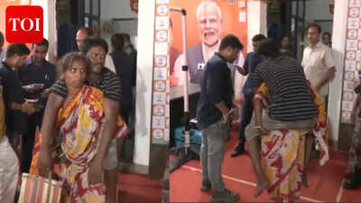 Watch: Woman carries husband on her back  at CM Suvendu Adhikari's Janta Darbar in Kolkata