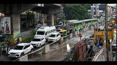 Waterlogging and damaged roads choke traffic in city