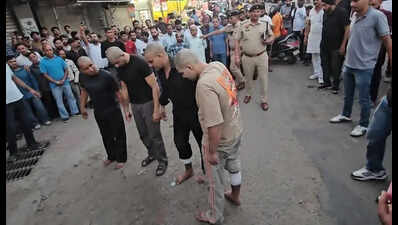 Panchkula police parade four murder accused with shaved heads through Pinjore market