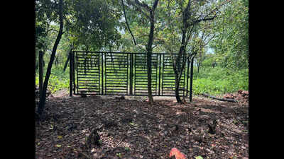 Metal gate at Mandur tenanted land kicks row