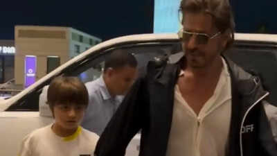 Shah Rukh Khan gets spotted at Mumbai airport with son AbRam Khan; superstar flashes his signature smile at paps - Watch