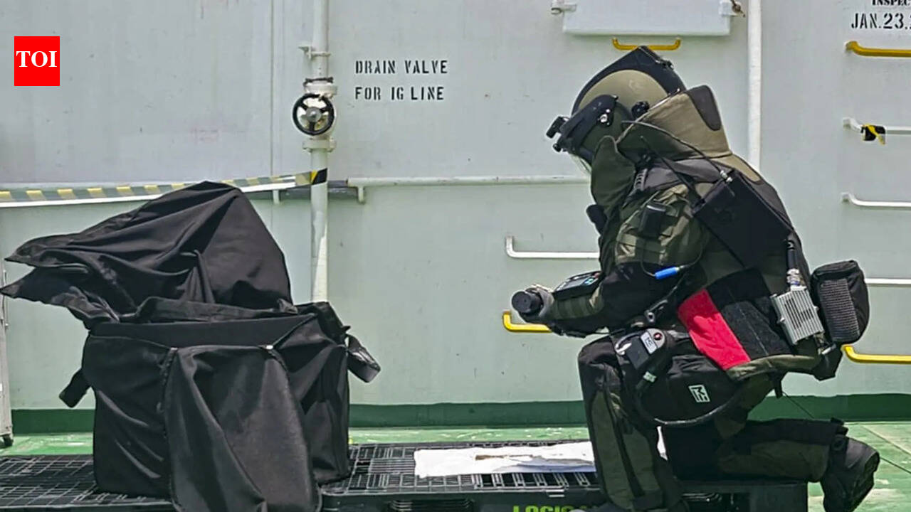 Navy removes unexploded warhead from struck ship