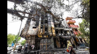 Elderly Woman Rescued as Fire Tears Through Multi-Storey Building
