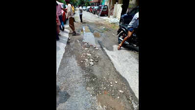 Roads broken, residents seek repairs before monsoon sets in