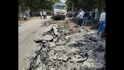 Truck tilts as road caves in at Dindoli; pipeline leak blamed
