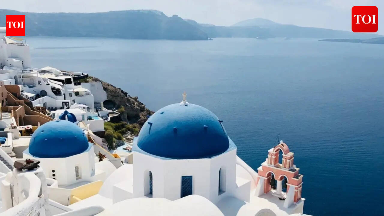 Why are Santorini’s houses painted in white and blue?