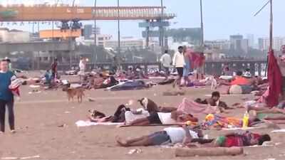  Mumbai residents seen sleeping on Versova beach shores to escape intense heat