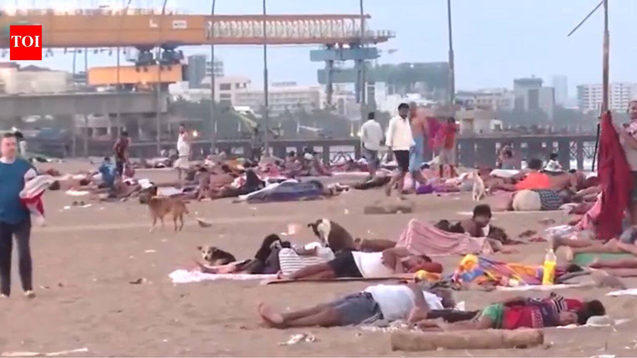 'Difficult to stay inside': Mumbai residents seen sleeping on Versova beach shores to escape intense heat