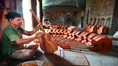  The Bengal village making handmade guitars for musicians across South Asia