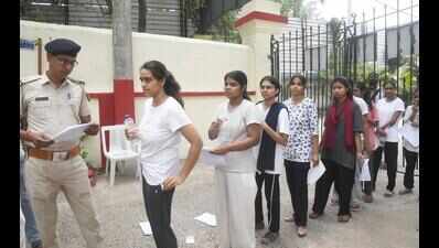 Handcuffed jail inmate appears for NEET re-exam