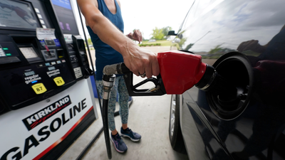 a-customer-readies-to-pump-gas-ap-photo.jpg