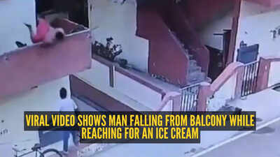 Watch: Man falls from first-floor balcony while trying to grab an ice cream from vendor below