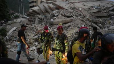  Race against time as rescuers battle rubble to find survivors; death toll tops 1400