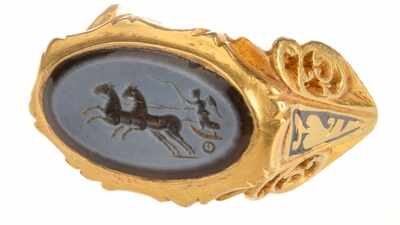An amateur detectorist uncovered a spectacular Roman gold ring buried for 1,700 years with a hoard of 297 coins, shedding new light on the site's ancient past