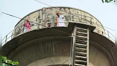 Six climb elevated reservoir against bajri lease, come down after assurance