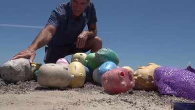 Why dozens of mystery piggy banks suddenly appeared on Texas shoreline: How much cash did they contain?