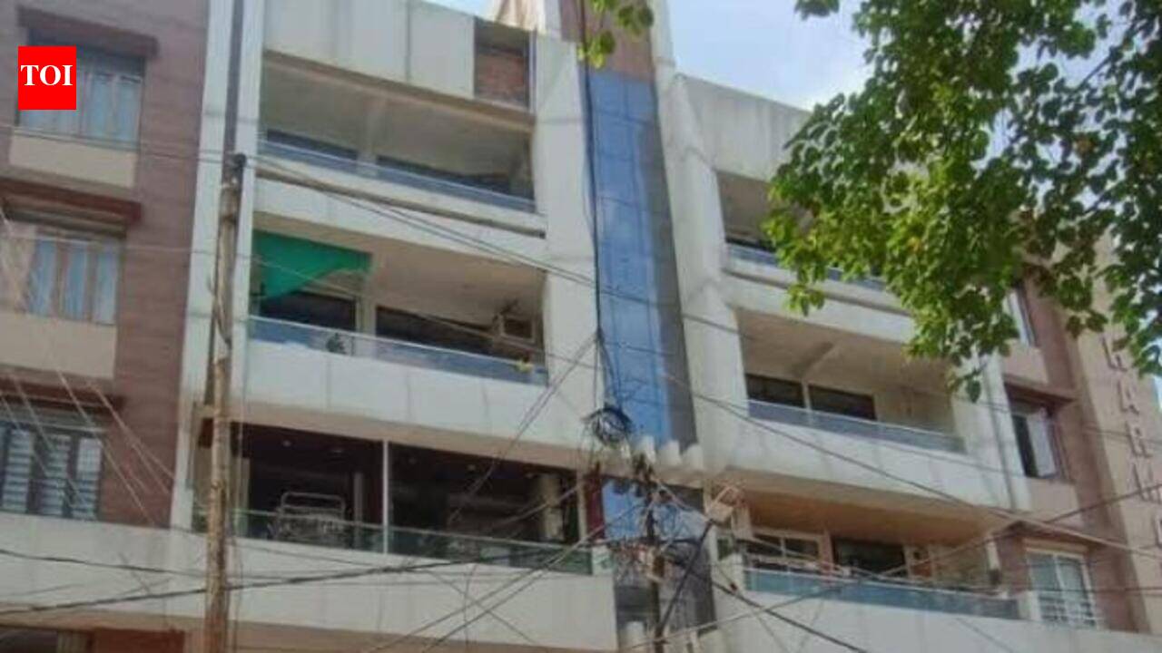 Four-storey apartment sealed as basement caves in