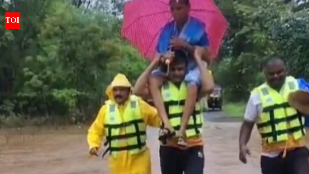 Raigad cop carries 72-year-old woman on shoulder, wades through flooded road to reach her to safety