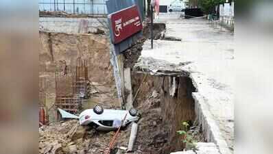 Car plunges into pit as compound wall collapses at construction site in Ahmedabad’s Satellite area
