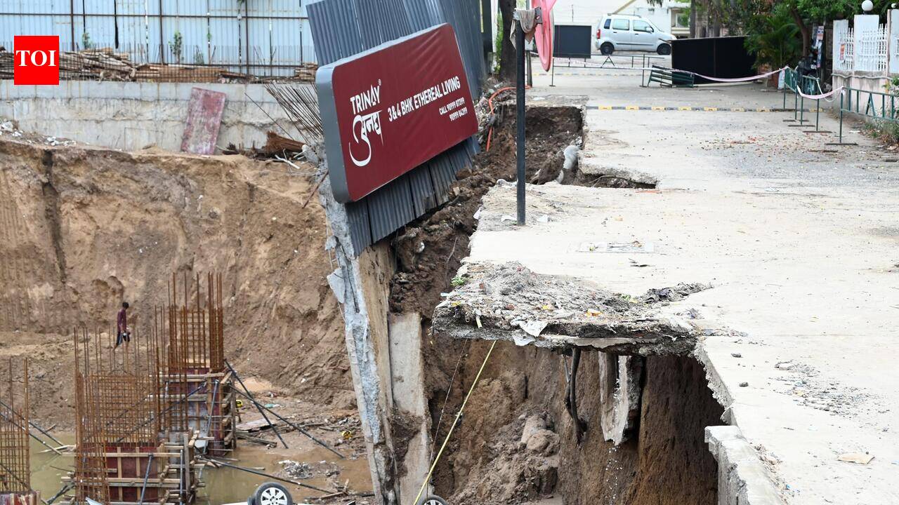 Car plunges into pit as compound wall collapses at construction site in Ahmedabad’s Satellite area