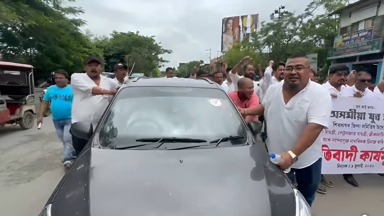 AYM members push car down Sivasagar roads to protest against fuel price hike