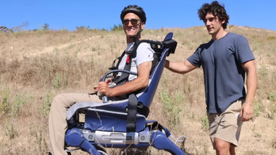 His father could no longer go where wheelchairs stopped. So he turned an industrial robot into a walking mobility chair