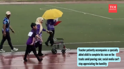 Teacher patiently accompanies a specially abled child to complete his race on the tracks amid pouring rain; social media can't stop appreciating the humility