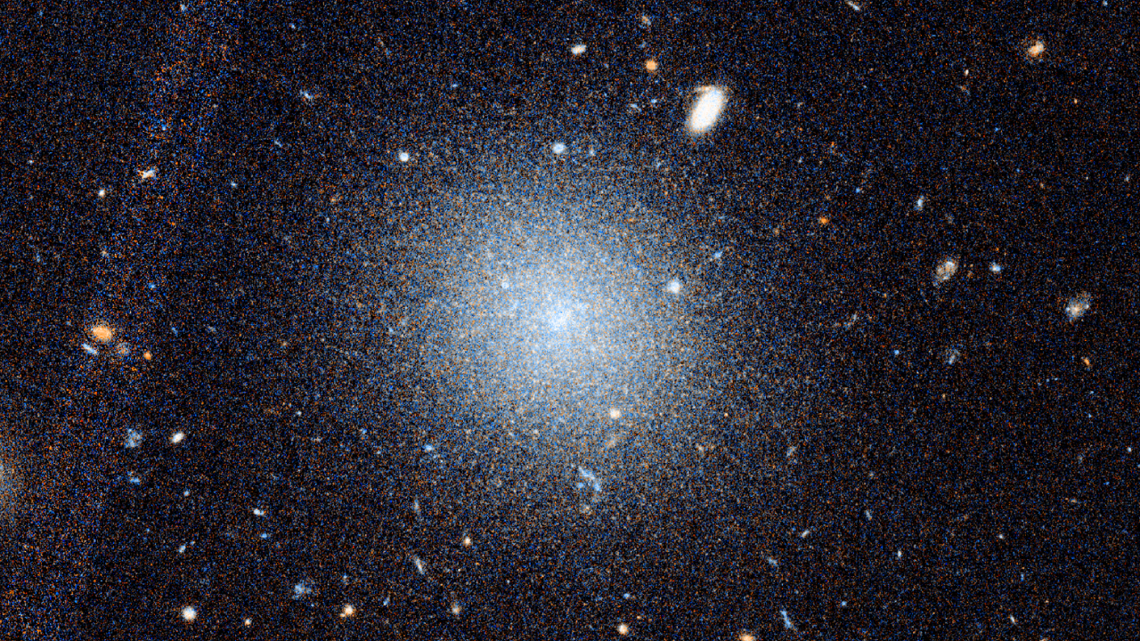 A third galaxy found without dark matter makes a cosmic mystery harder to explain