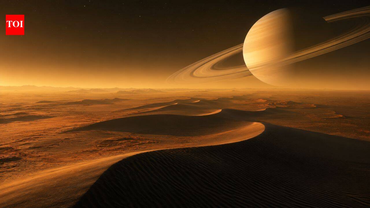 Why does Saturn's largest moon, Titan, have giant dunes that aren't made of sand like Earth's
