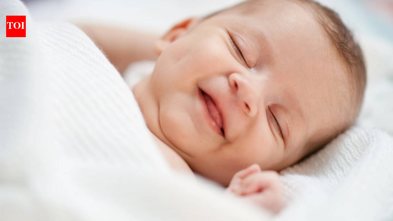 Why do babies smile in their sleep? Experts say those adorable grins may have less to do with dreams than parents think