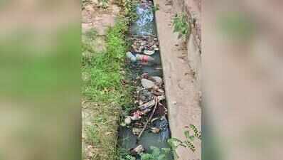 Choked with garbage, drains spilling sewage back onto roads, say residents