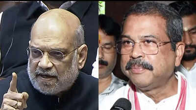 Amit Shah & other top BJP functionaries call on Pradhan at his residence to show solidarity