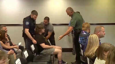 A high school Physics teacher left the Kansas city council meeting on voting for datacenter in handcuffs, dragged out by police after clapping at …