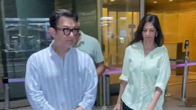 Aamir Khan returns to Mumbai with wife Gauri Spratt; stepson surprised by paparazzi rush - Video