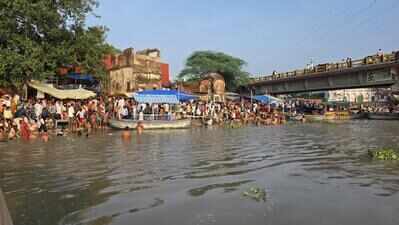 Devotees take holy dip and offer prayers at Ganga ghats on occasion of Guru Purnima