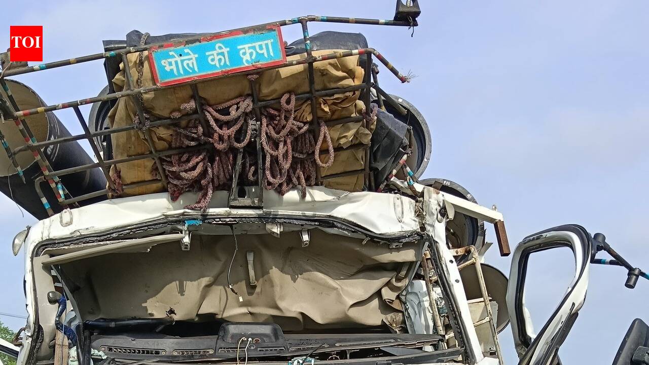 Truck hits another vehicle, driver injured
