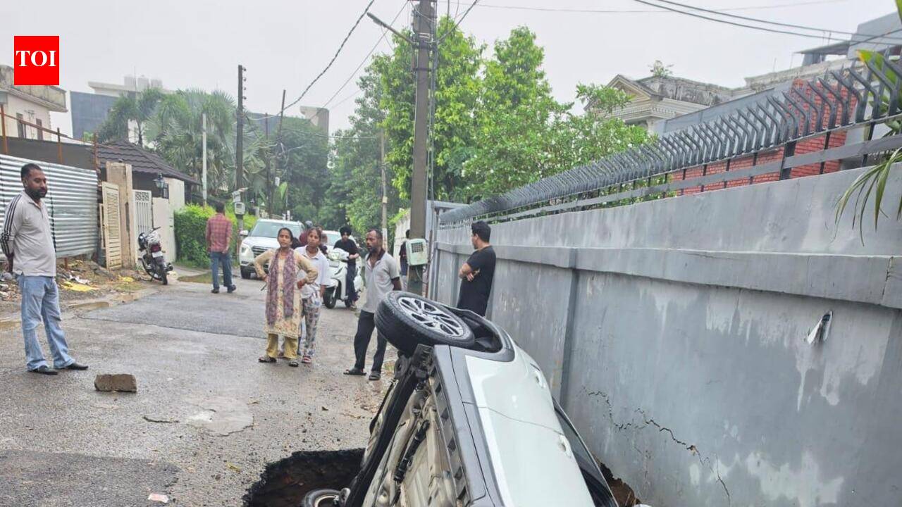 Car plunges into crater as Gurdev Nagar road caves in; driver escapes