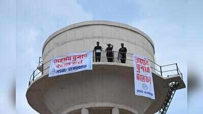 NSUI protesters climb water tank, demand Shah’s resignation, student polls