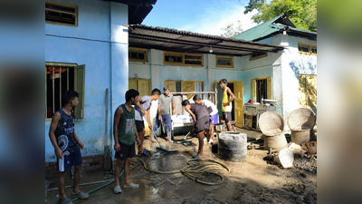 120 youths band together to revive homes buried in mud, receive payment in smiles
