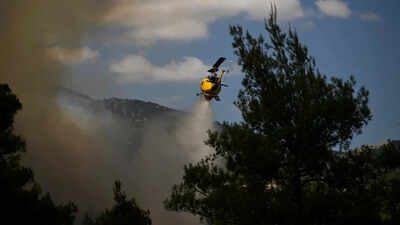 Watch: Firefighting helicopters collide mid-air as Greece battles massive wildfire